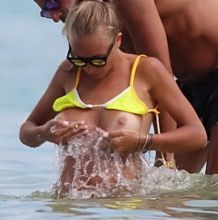 Laura Cremaschi boobs pop out from tiny bikini topless on the beach in Miami 16x HQ photos