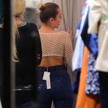 Miley Cyrus in see through top shopping in Soho 5x HQ photos