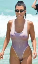 Kourtney Kardashian sexy pokies in wet white swimsuit candids on the beach in Miami 19x HQ photos